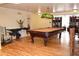 Well-appointed game room featuring a billiard table, unique table and chairs at 2521 Clipper Ship Way, Sarasota, FL 34231