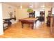 Game room with a billiard table, unique table and chairs, and wood floors at 2521 Clipper Ship Way, Sarasota, FL 34231