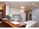 Modern kitchen featuring white cabinetry and a breakfast bar at 2521 Clipper Ship Way, Sarasota, FL 34231