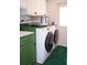 Bright laundry area features new washer and dryer with countertop space at 2521 Clipper Ship Way, Sarasota, FL 34231