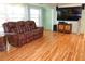 Inviting living room with comfortable leather seating and bamboo flooring at 2521 Clipper Ship Way, Sarasota, FL 34231