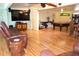 Spacious living room with wood floors, flat screen tv, and a pool table at 2521 Clipper Ship Way, Sarasota, FL 34231