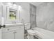 Bathroom featuring modern vanity with updated lighting, mirror, towel rack and toilet next to the shower-tub at 2717 Hidden Lake Blvd # C, Sarasota, FL 34237