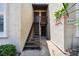 Condo entrance with a stairway, private balconies, and well-maintained exterior at 2717 Hidden Lake Blvd # C, Sarasota, FL 34237
