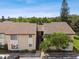 Exterior view of building featuring well maintained landscaping and a new roof at 2717 Hidden Lake Blvd # C, Sarasota, FL 34237