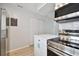 Modern kitchen featuring white appliances and plenty of cabinet space at 2717 Hidden Lake Blvd # C, Sarasota, FL 34237