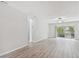 Open living area with a large window and new floors is flooded with natural light at 2717 Hidden Lake Blvd # C, Sarasota, FL 34237