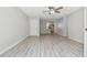 Spacious living room with wood-look flooring and an open layout, next to kitchen at 2717 Hidden Lake Blvd # C, Sarasota, FL 34237