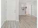 Open living area features new floors and access to the kitchen and closets at 2717 Hidden Lake Blvd # C, Sarasota, FL 34237