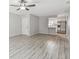 Spacious living area features new floors and access to the kitchen with stainless appliances at 2717 Hidden Lake Blvd # C, Sarasota, FL 34237