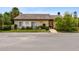 Exterior view of office building with professional landscaping, visible signage, and easy access at 2717 Hidden Lake Blvd # C, Sarasota, FL 34237