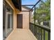 Enclosed patio with tan walls and screen enclosure at 2717 Hidden Lake Blvd # C, Sarasota, FL 34237