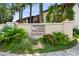 Landscaped community sign for Hidden Lake Village Condominiums with colorful foliage and greenery at 2717 Hidden Lake Blvd # C, Sarasota, FL 34237