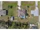 Overhead shot of home with a pool, lush backyard, utility shed and mature landscaping at 3816 N Cranberry Blvd, North Port, FL 34286