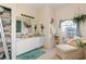 Bathroom boasts natural light, a double vanity, a lounge, and ample storage at 3816 N Cranberry Blvd, North Port, FL 34286