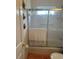 Bathroom featuring a shower/tub combo with sliding glass doors at 3816 N Cranberry Blvd, North Port, FL 34286
