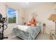 Cozy bedroom features a queen bed, sunny window, and fitness equipment at 3816 N Cranberry Blvd, North Port, FL 34286