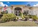 Inviting front entrance with decorative ironwork, lush greenery, and decorative features at 3816 N Cranberry Blvd, North Port, FL 34286