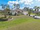 Beautiful home featuring lush landscaping, a well-manicured lawn, and a spacious driveway at 3816 N Cranberry Blvd, North Port, FL 34286