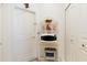 Hallway with appliances and storage, offering a practical and efficient space at 3816 N Cranberry Blvd, North Port, FL 34286