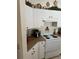Kitchen features white cabinets and appliances at 3816 N Cranberry Blvd, North Port, FL 34286