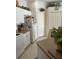 Compact kitchen features white cabinets and appliances, providing functionality and a clean aesthetic at 3816 N Cranberry Blvd, North Port, FL 34286