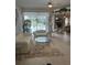 Bright living room with sliding glass doors offers seamless indoor/outdoor flow to the pool area at 3816 N Cranberry Blvd, North Port, FL 34286