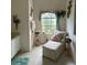 Cozy sitting area next to a window with natural light and decor at 3816 N Cranberry Blvd, North Port, FL 34286
