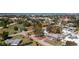 Aerial view showcasing a cozy home nestled in a lush, tree-filled neighborhood near a three-way intersection at 434 W Grace St, Punta Gorda, FL 33950