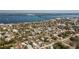 Expansive aerial view of a coastal neighborhood with lush greenery, waterways, and a bridge in the distance at 434 W Grace St, Punta Gorda, FL 33950