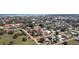 Aerial view showcasing a cozy home nestled in a lush, tree-filled neighborhood at 434 W Grace St, Punta Gorda, FL 33950