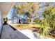 Charming backyard featuring a cute blue shed and a sprawling shade tree at 434 W Grace St, Punta Gorda, FL 33950
