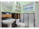 Unfinished bathroom with a pedestal sink and exposed framework at 434 W Grace St, Punta Gorda, FL 33950