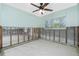 Partially renovated room featuring exposed block wall, framing, a window, and a ceiling fan at 434 W Grace St, Punta Gorda, FL 33950