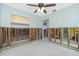 Under renovation bedroom featuring exposed framing, block wall, and open access to the bathroom at 434 W Grace St, Punta Gorda, FL 33950