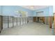 Renovated bedroom featuring exposed block wall, framing, ceiling fan, and a window with natural light at 434 W Grace St, Punta Gorda, FL 33950