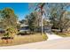 Charming single-story home with mature trees, a well-maintained lawn, and a fire hydrant at 434 W Grace St, Punta Gorda, FL 33950