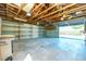 Spacious garage with exposed beam ceiling and ample storage shelving at 434 W Grace St, Punta Gorda, FL 33950