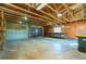 Bright garage with exposed ceiling beams and a work bench by the window at 434 W Grace St, Punta Gorda, FL 33950