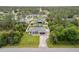 An aerial view of a lovely single Gathering home with screened-in pool and fenced yard in a quiet residential neighborhood at 4571 La Rosa Ave, North Port, FL 34286