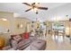 Spacious living room with tile floors, neutral paint, and an open concept layout connecting to the kitchen and dining areas at 4571 La Rosa Ave, North Port, FL 34286