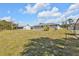 Spacious backyard featuring lush green grass and a well-maintained fence line at 5211 Prime Ter, North Port, FL 34286