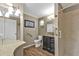 Updated bathroom featuring stylish vanity, modern fixtures, and a clean, glass-enclosed shower stall at 5211 Prime Ter, North Port, FL 34286