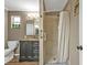 Bathroom with a shower and tub, along with modern fixtures and stylish vanity at 5211 Prime Ter, North Port, FL 34286
