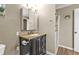Cozy bathroom with modern vanity, toilet, framed mirror and glass enclosed shower at 5211 Prime Ter, North Port, FL 34286