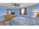 Bedroom featuring hardwood floors, large windows, and a spacious layout at 5211 Prime Ter, North Port, FL 34286