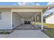 Covered carport area with ample space for parking and storage, providing convenience and protection from the elements at 5211 Prime Ter, North Port, FL 34286