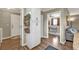 Hallway features wood floors, storage, and doorways to other rooms at 5211 Prime Ter, North Port, FL 34286