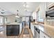 Open concept kitchen with island seating, stainless steel appliances and ample storage space at 5211 Prime Ter, North Port, FL 34286