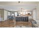 Kitchen featuring granite counters, stainless appliances, and a large central island at 5211 Prime Ter, North Port, FL 34286